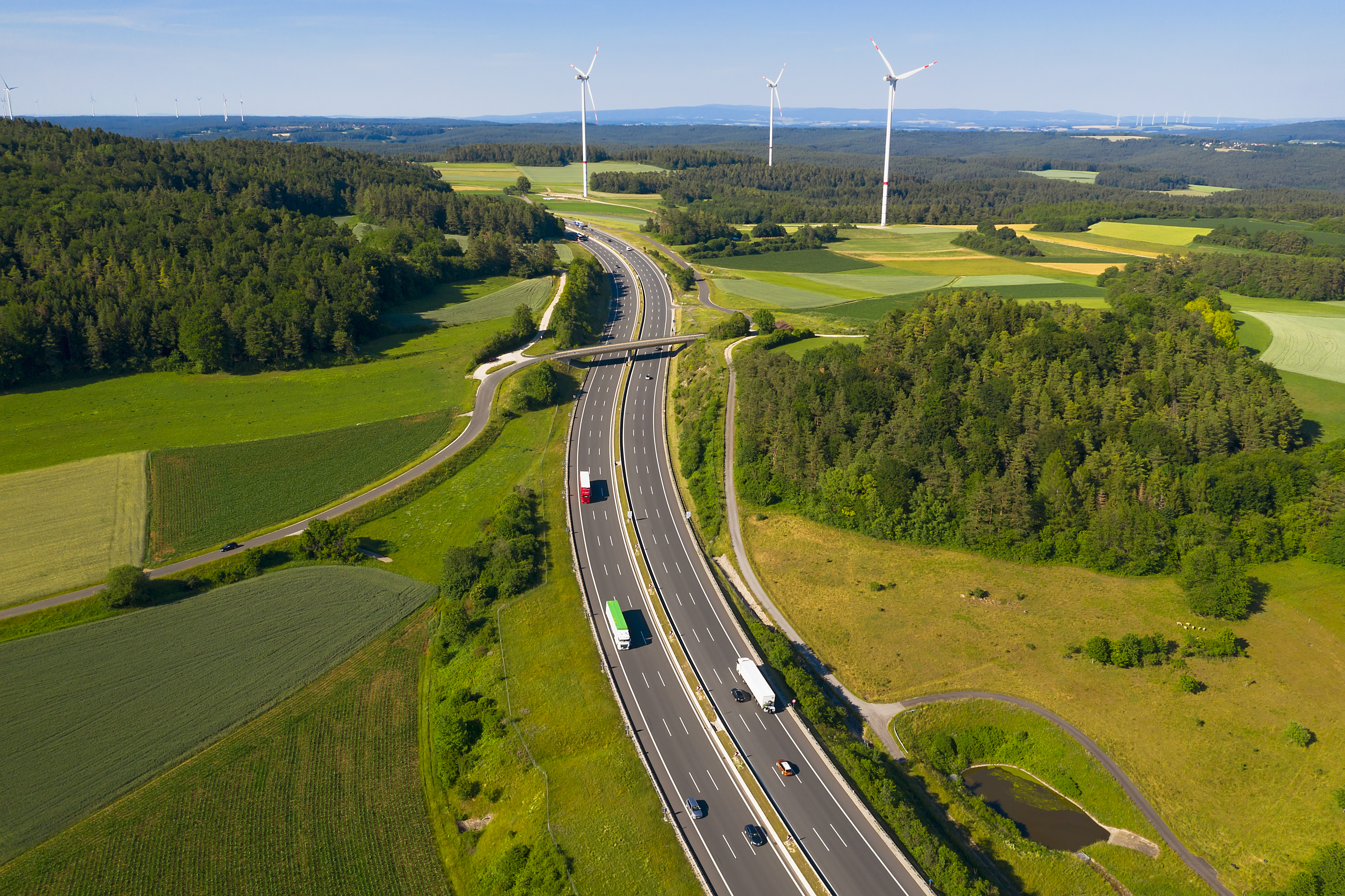 Trucks-on-the-autobahn-surrounded-by-wind-turbines.jpg