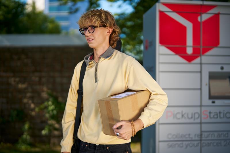 webimage-Young-man-picking-up-a-parcel.jpg