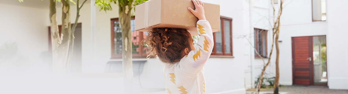 Child-holding-a-parcel-on-its-head.jpg